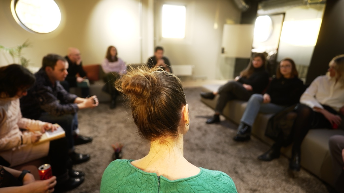 Irma facilitating an intimate small-group conversation